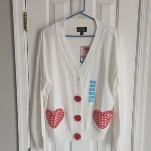 White Cardigan with Red Heart Accents